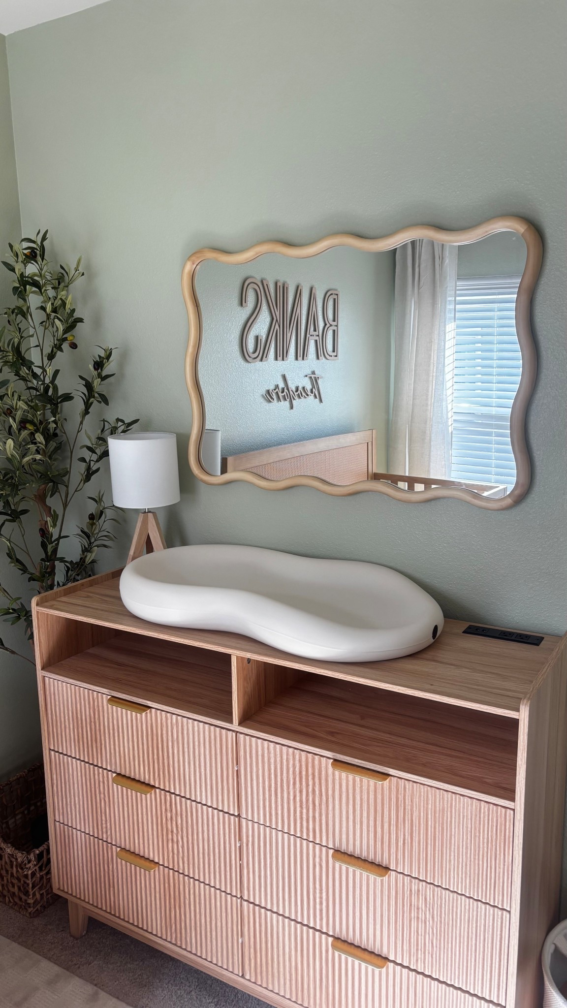 Nursery Decor

Nursery furniture  fluted dresser  scalloped mirror  changing table pad  faux olive tree  bedside lamp  checkered rug  baby crib  sheer curtains 

#LTKBaby #LTKHome #LTKmomlife