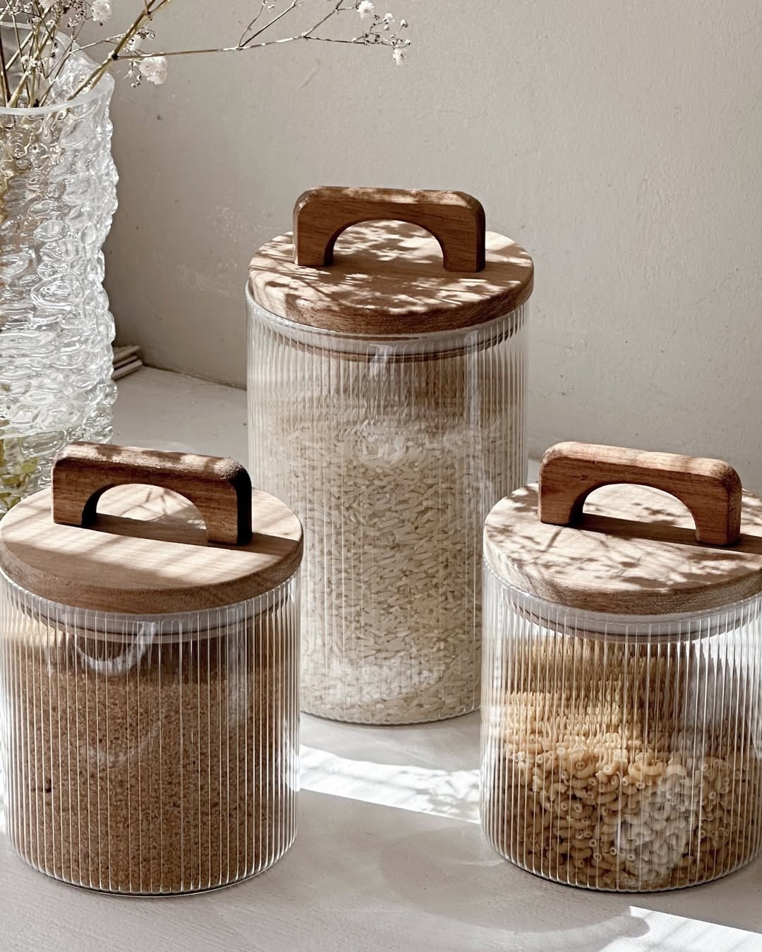 Obsessed with these Bernal Canisters! ✨ They're the perfect way to keep my pantry organized and looking chic. The ribbed glass and warm wood lids add a touch of understated elegance to my kitchen. I love how they display my everyday essentials in a beautiful way. Shop this set and other kitchen favorites on my LTK!
#LTKHome #LTKStyle #kitchenorganization #pantryorganization #canisters #kitchenstorage #homedecor #interiordesign
#kitchendesign #homeinspo #interiorstyling #cozykitchen #glasscanisters #woodenlids #bernalkanisters

#LTKSeasonal #LTKActive #LTKHome