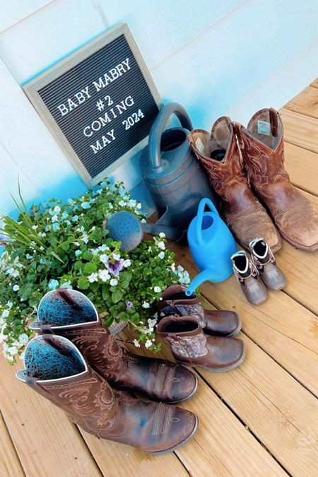 hehe all the fam’s cowboy 🤠 boots next to our “mama & Judson” watering cans 💦 - the sweetest lil’ view!!🤰🩵👶🏼🫶🏽🥹

#LTKbaby #LTKfamily #LTKGiftGuide