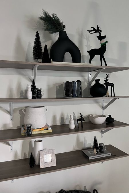 Black and white Christmas decor. 

Love my black reindeers!
Shelves 
Home decor
Holiday decor
Christmas
Snowman
Vases
Home blogger 

#LTKSeasonal #LTKHoliday #LTKhome