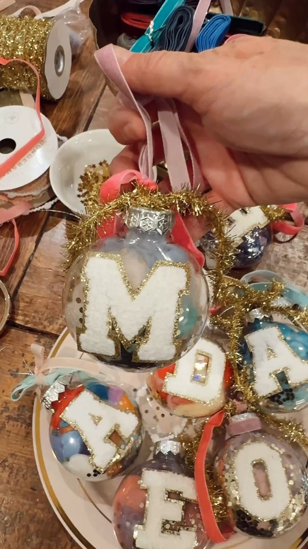 DIY Anthropologie Inspired initial ornaments
-add a little glitter/confetti to the ornament, swirl around. then add 3-4 wool yarn and fill the ornament. Finish off with velvet and gold ribbon. Add the initial letter. 

#LTKSeasonal #LTKHoliday #LTKGiftGuide