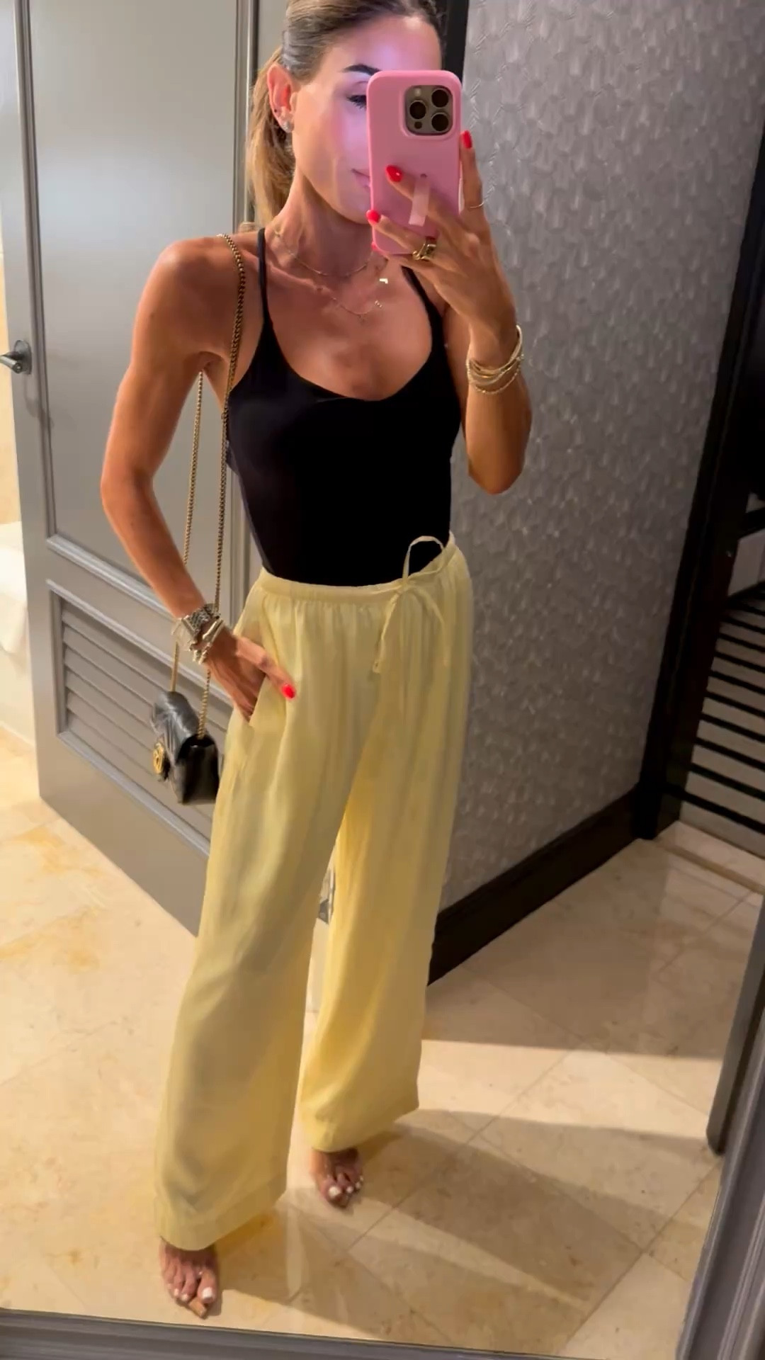 Yellow satin pants size xxs petite with black strappy tank with adjustable straps size xs 
Date night outfit, vacation outfit 

#LTKSaleAlert #LTKPetite