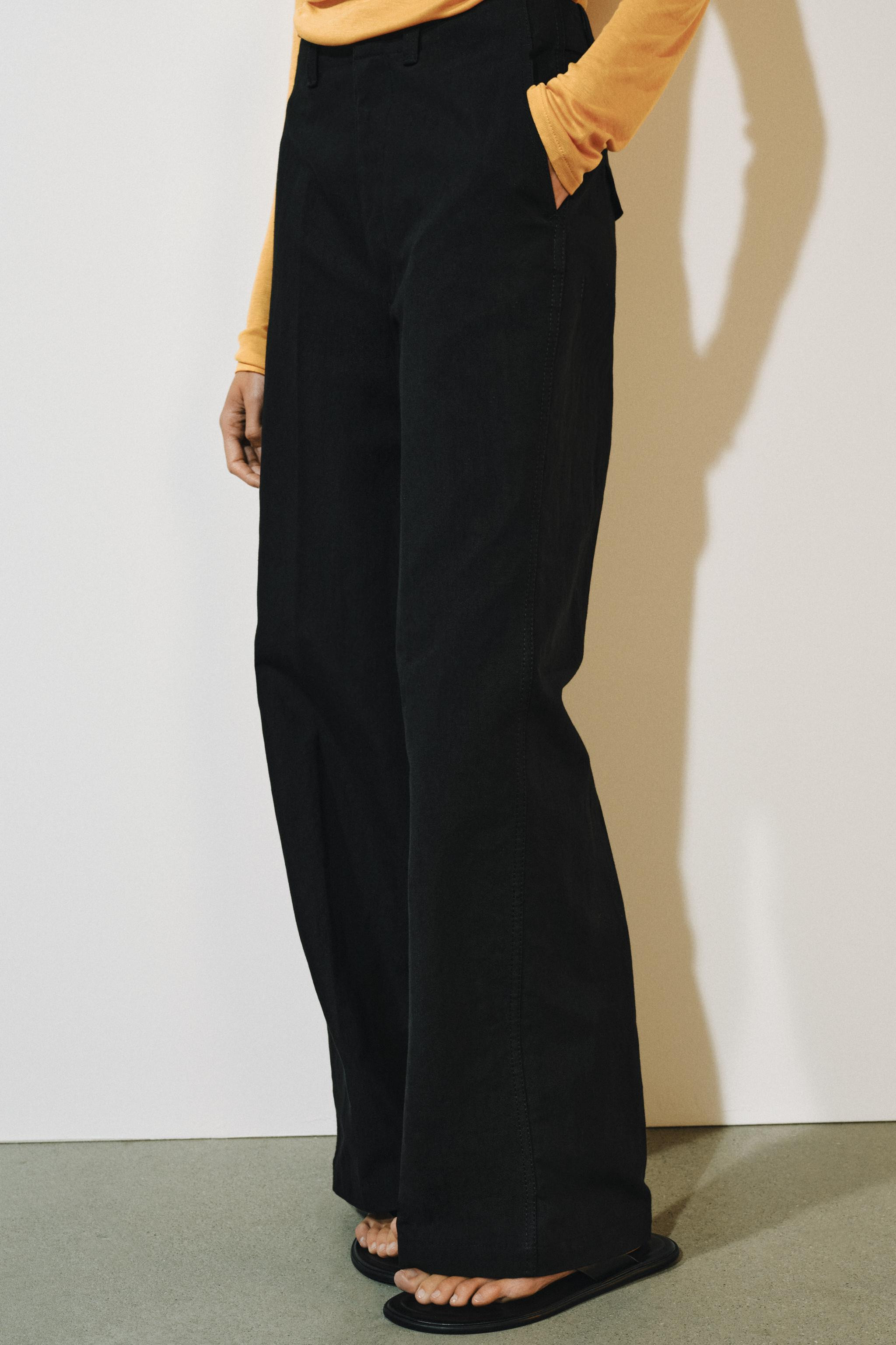 ZARA WOMAN COLLECTIONMid-rise trousers with a waistband with belt loops. Side pockets hidden in t... | Zara US