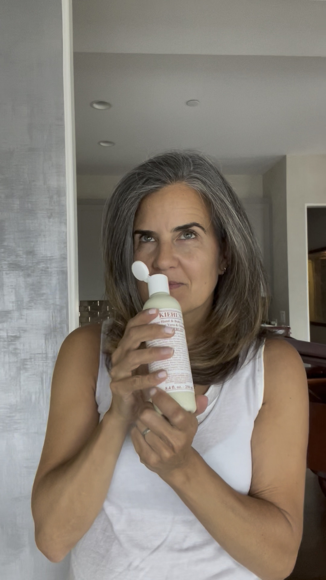 My new favorite body lotion is from Khiel's--it a yummy hand & body lotion for all skin types. My skin runs dry all year long, but right now it's dry from spending time gardening with my dad. 

I don't like heavy lotion, this is the right mix and smoothes on easily. It's got soothing properties (aloe and oatmeal), so if you've overdone it on sun, it's a great option.

The very best part is the scent---it's a light grapefruit scent that's perfect for summer. If you don't like grapefruit, this insn't for you, but you WON'T smell like a fruit salad either. 
 

Perfect way to give your skin a summer glow. ☀️ 

#LTKbeauty #LTKunder50