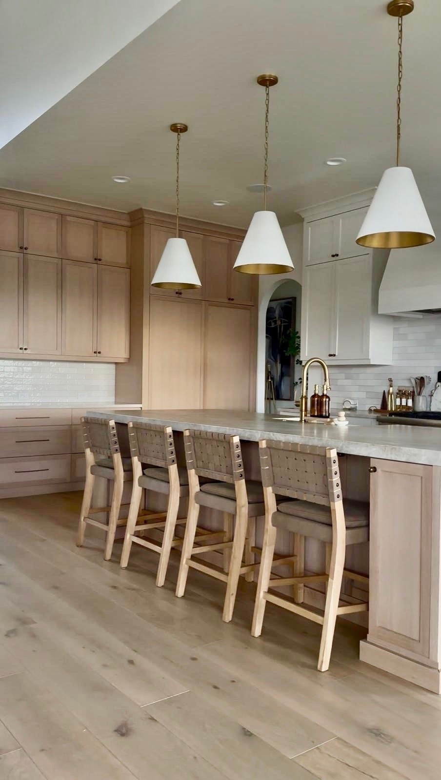 I’m linking the counter stools, pendant lights, and faucet I used here because they’re the pieces that really ground this kitchen. The woven stools add texture, the brass accents bring warmth, and the simple shapes keep everything feeling clean and balanced.

I tend to choose materials like wood, brass, and soft neutrals so the space feels layered but still easy to live in. Sharing everything here if you’re creating a kitchen that feels both functional and quietly elevated.
@Nathan James 
 @Wayfair 
@lowes 
@Amazon

#LTKHome #LTKSaleAlert #LTKU