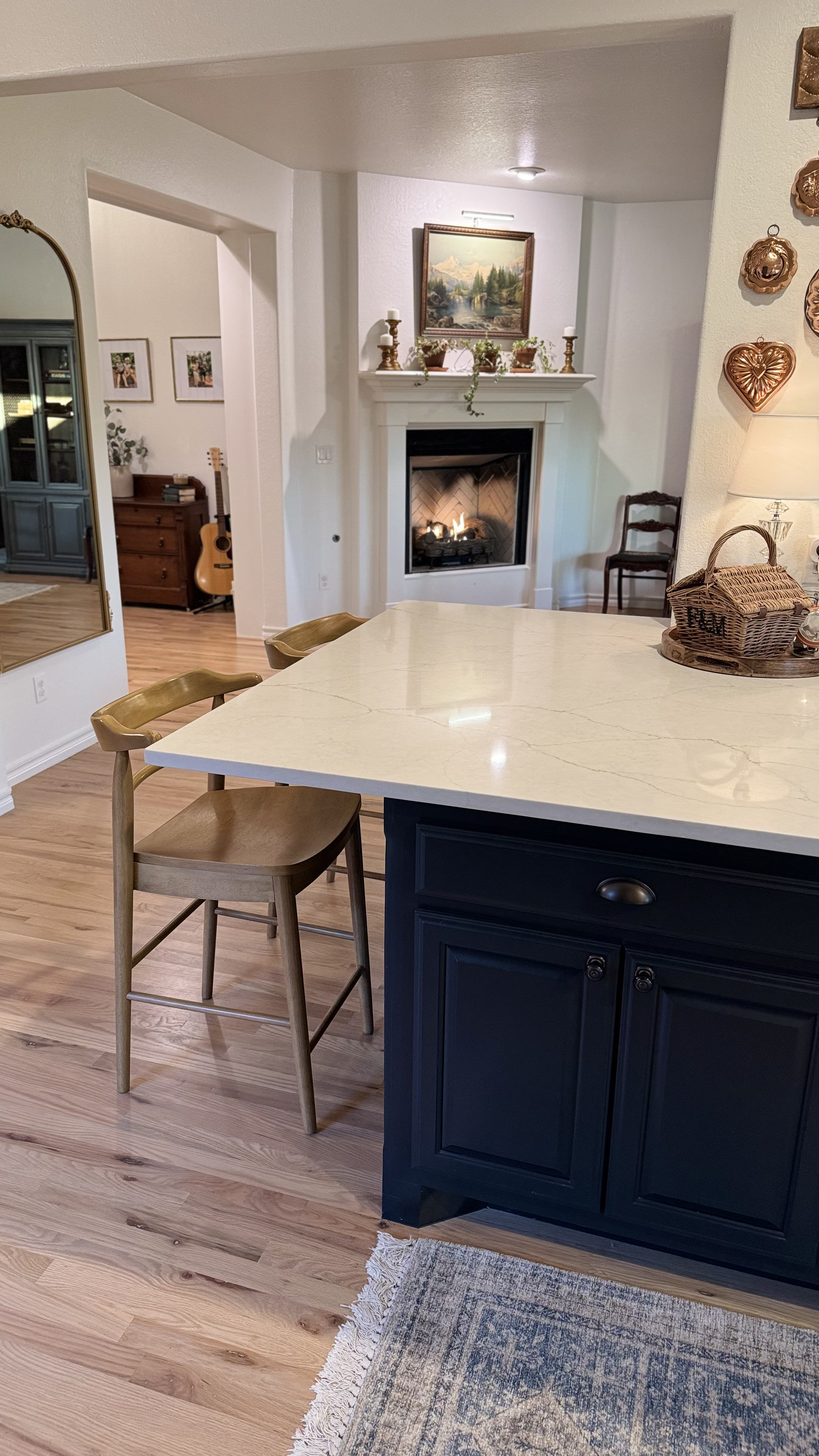 Kitchen barstools on each side of the counter. Light wood, real wood, counter height