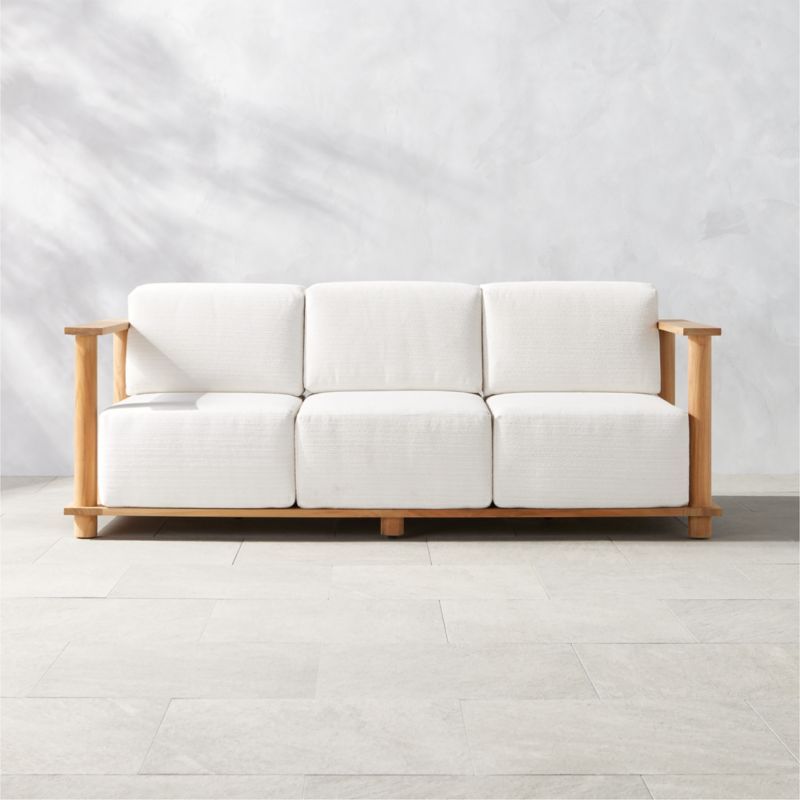 Pinet 84" Teak Outdoor Sofa With Textured Ivory Perennials Cushions by Ross Cassidy | CB2 | CB2