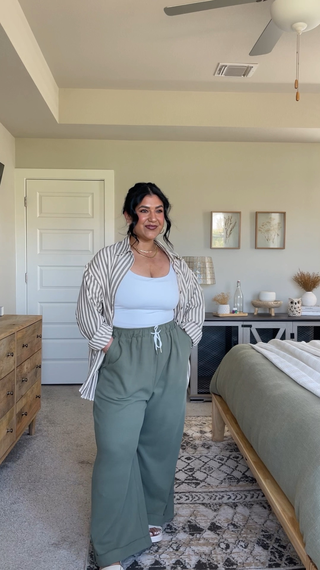 I’m 5’1”, size 10-12, usually a large⁣ // PANTS: size large, shade green. These are a lightweight cotton material, very flowy and have a stretchy waist.⁣ // BUTTON-UP: I sized up to an XL for an oversized fit, shade Tan. This button-up is such nice quality. Lightweight but also not thin and see through.⁣ // CAMI: size large, double lined, comes in a pack of two with black. // SANDALS: true to size, shade Beige. my favorite Amazon sandals! // *I will also link the oversized grey tee (wearing a large), my favorite cami bra (size up), and all my jewelry.⁣ 
⁣

#LTKPetite #LTKMidsize #LTKFindsUnder50