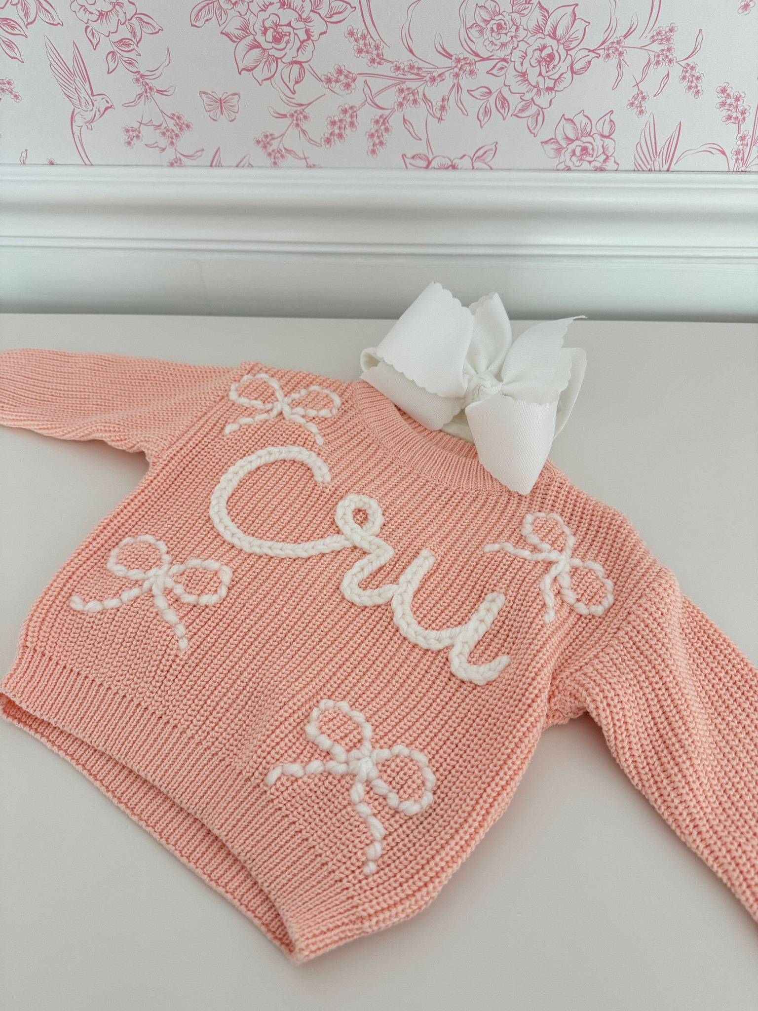 Custom baby name sweater 
Hand stitched baby name sweater 
Bow name sweater 
Etsy baby name

#LTKBump #LTKBaby #LTKSaleAlert