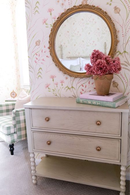 To complete the look, we accessorized the room with small pieces like the custom wallpaper art I created to add character and art. You can see more on how I did this on my Instagram highlight labeled pink & green room.  We also added a few pieces of furniture to create a functional reading space for our guests. The green gingham armchair provides a cozy spot for reading and sipping coffee or just relaxing and looking out the window, all while giving a nice contrasting touch of patterns. We also added a matching dresser to the bed with a mirror over its top with a great find from Round Top, Texas, and this adds a spot for guests to have a mirror as well as store their clothing. Extra blankets were added in this dresser in case the guests get cool at night or while sitting in the armchair. Together, these elements create a warm and inviting space that any guest will find fantastic!

#LTKFind #LTKunder50 #LTKhome