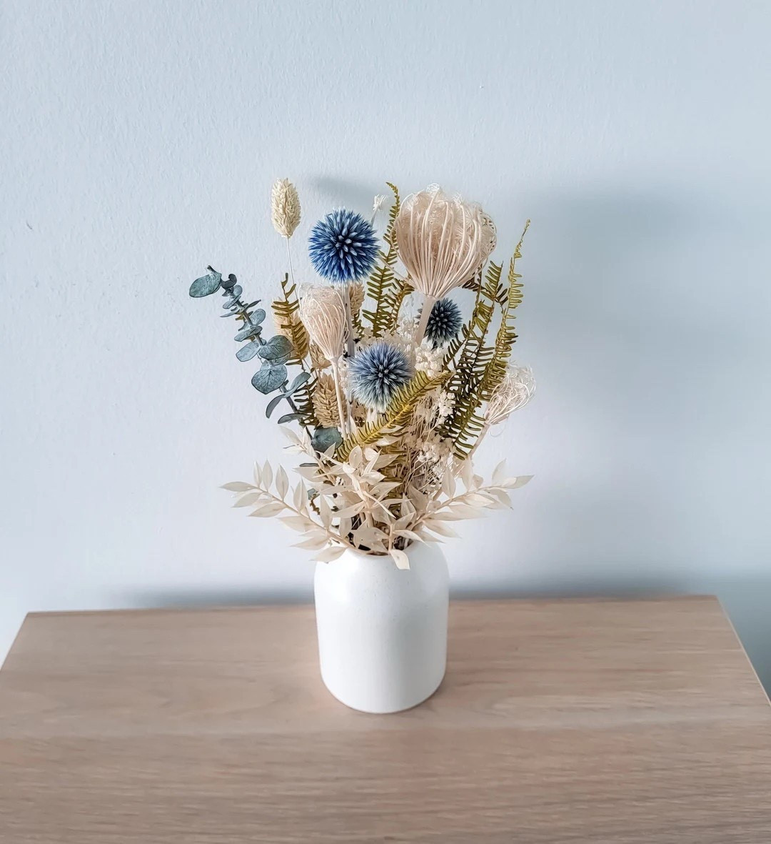 Add a soft pop of color with this white, blue, and green dried floral bouquet arrangement. Perfect for styling bud vases, creating charming centerpieces, dressing up tablescapes, or adding a special touch to bridesmaid proposal boxes and party favors. Thoughtful, versatile, and beautifully long-lasting, these blooms bring effortless elegance to any occasion. #LTKHome #LTKWedding #DriedFlowers #HomeDecor #BridesmaidGifts #PartyDecor #CenterpieceIdeas #EtsyFinds #FloralDecor #GiftIdeas

#LTKSeasonal #LTKWedding #LTKHome