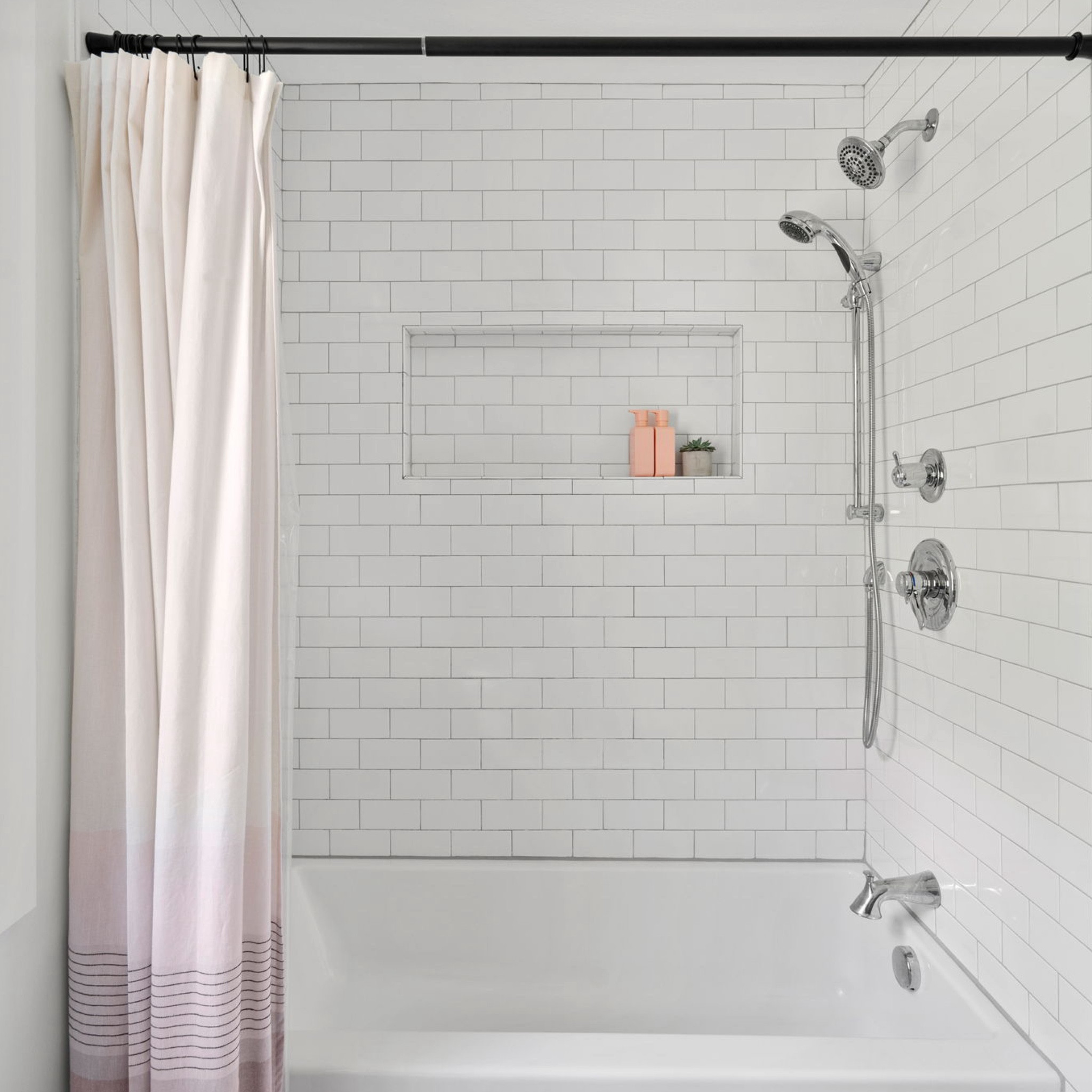 when upgrading this basic ‘90s new construction bathroom as part of a #dwelloctoberstudio renovation, we opted for classic finishes that would stand the test of time. the gray vanity served as the jumping off point for this design. when vanity shopping, one of our favorite tips is to purchase a vanity base only, then customize it with your desired sink and stone countertop. we also swapped out the standard hardware for more modern matte black handles and knobs. the marble hexagon floor tile and simple white subway tile on the shower walls tie into the vanity, while subtle pink accents in the bath mat and shower curtain add a touch of warmth to the space. #dwelloctober

#LTKhome
