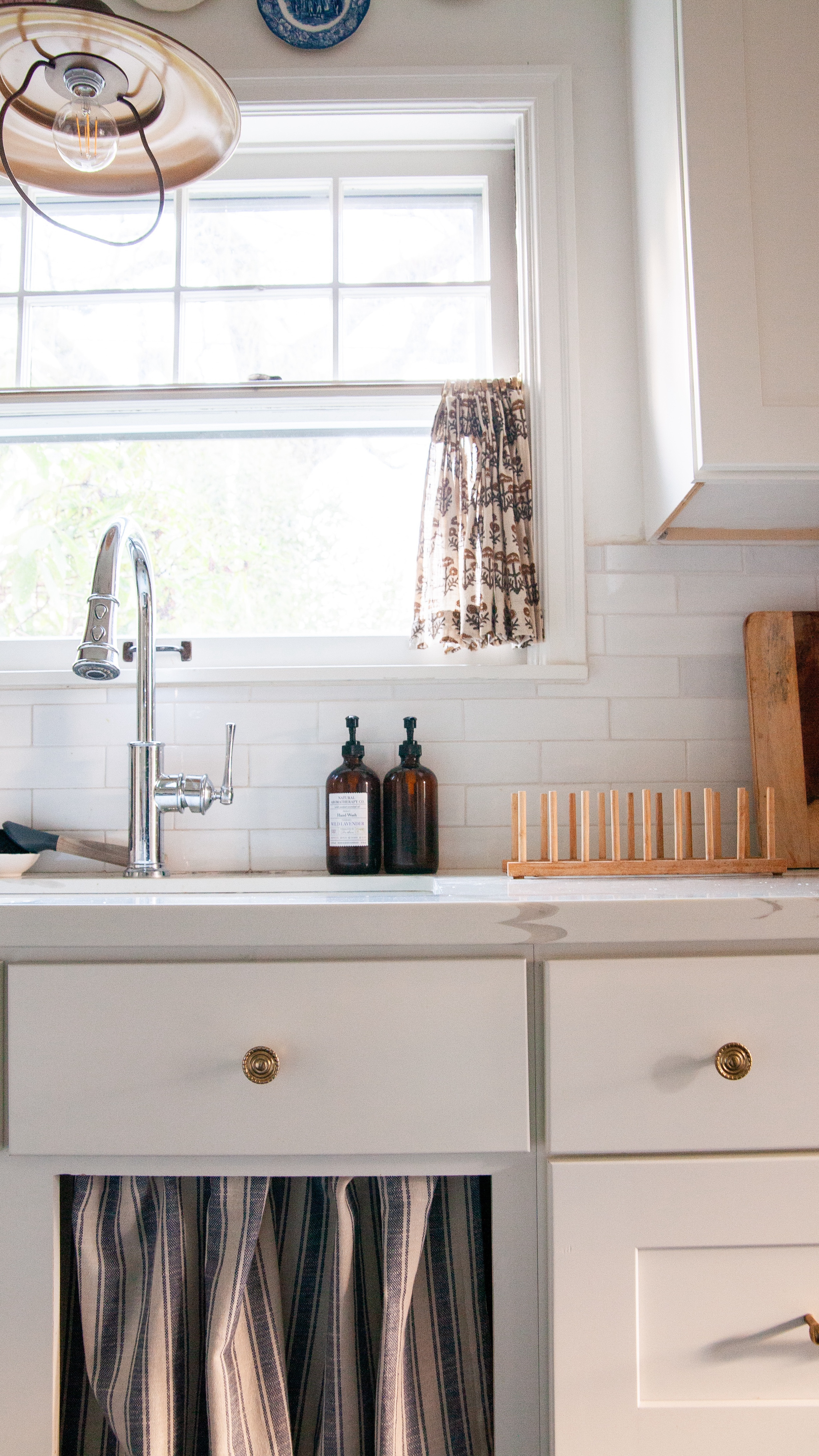 I also got some positive ones too, of course. Some nostalgia for 1950s kitchens people grew up with that also had these. I also got some practical comments that because this is near the trash, the fabric will get dirty. Yep, that makes sense. We don’t make that much trash and put food waste in the compost on the counter so I don’t think I’ll have to wash it every couple weeks or anything. I appreciate the concerns… but I guess this is part of my campaign against Internet trolls! Also to be fair, all of these negative comments were from Facebook! I’m excited to be adding some more charm to this kitchen, and these sink cabinet curtains are just step one!

#LTKHome