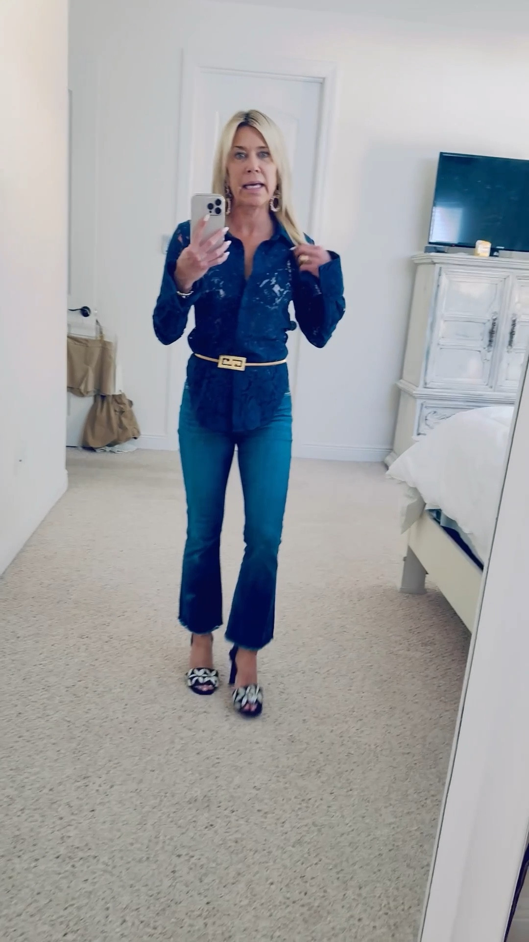 Love the look of a modern lace top in a bold color such as this Rick blue. The flare cuffs make a great style statement. Worn with cropped flare jeans belted. Best is from Bishop Boutique in Alexandria, VA. Top and jeans fit true to size.

#LTKPetite #LTKOver40 #LTKStyleTip