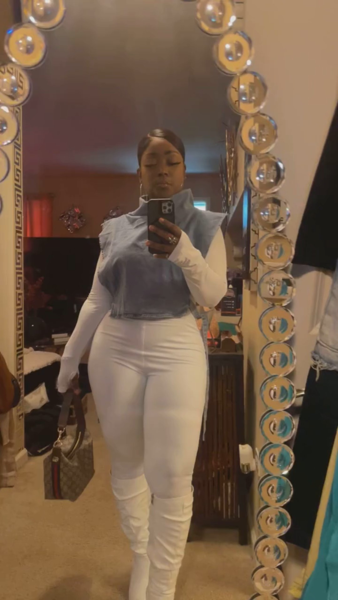 Wait for it….
One piece form fitting jumpsuit, paired with a blue Jean pullover vest….. White simi slouch boots , and hand Gucci  Bag.

#LTKItBag #LTKPetite #LTKStyleTip