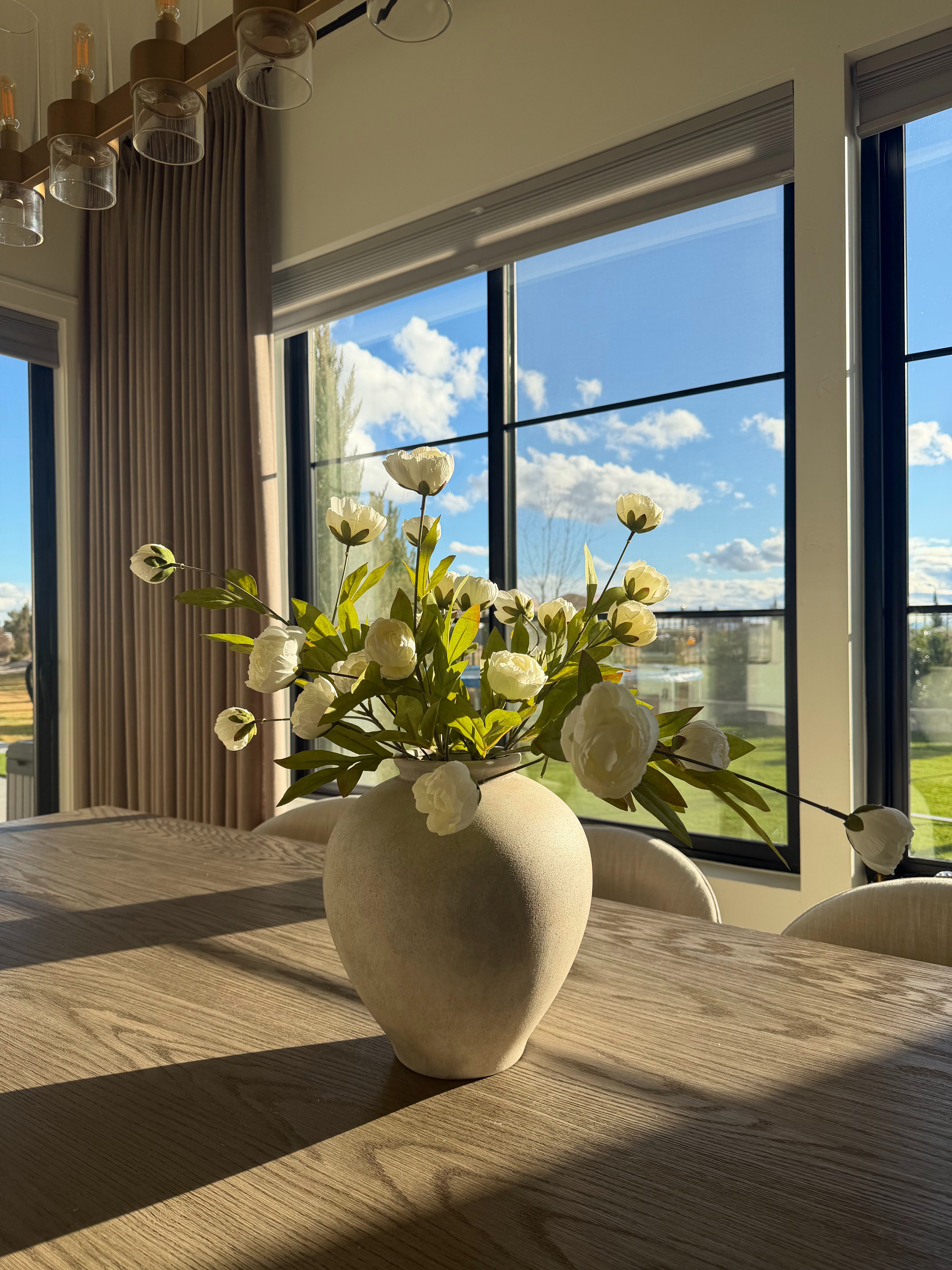 I linked the vase and faux stems because they add so much impact without overwhelming the room.

I love using a large neutral vase with soft white blooms on a dining table. It brings in texture, height, and a collected look that feels timeless through every season.

Shop the vase, stems, and dining room details I’m using here.
@Wayfair 
@Lowe's 
@Walmart

#LTKU #LTKHome #LTKSaleAlert
