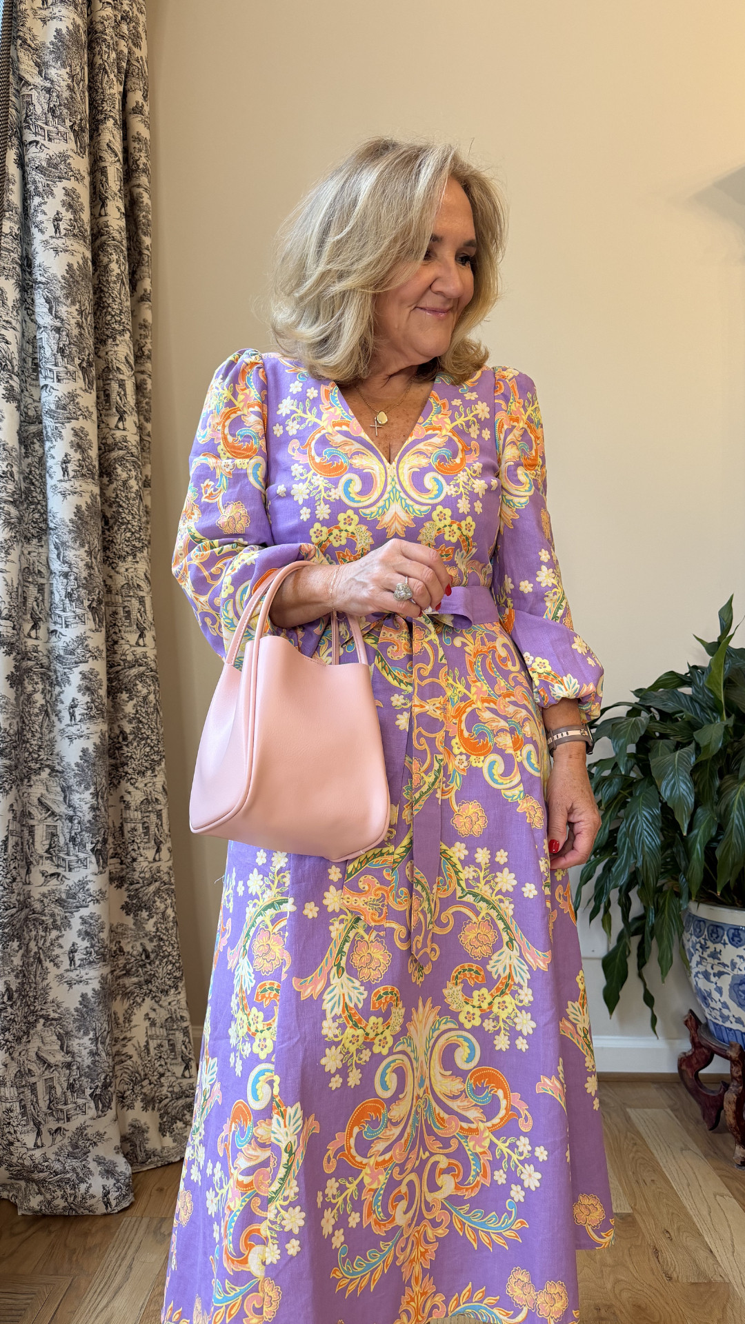 Obsessed with this vibrant paisley midi dress for summer 💜✨ Perfect for garden parties, brunch dates, vacation dinners, bridal showers, and chic daytime events. The colorful print makes such a statement while still feeling elegant and timeless. Styled with a soft pink handbag for the prettiest feminine touch. 🫶🏻 

 #LTKootd #LTKSeasonal #LTKOver40
