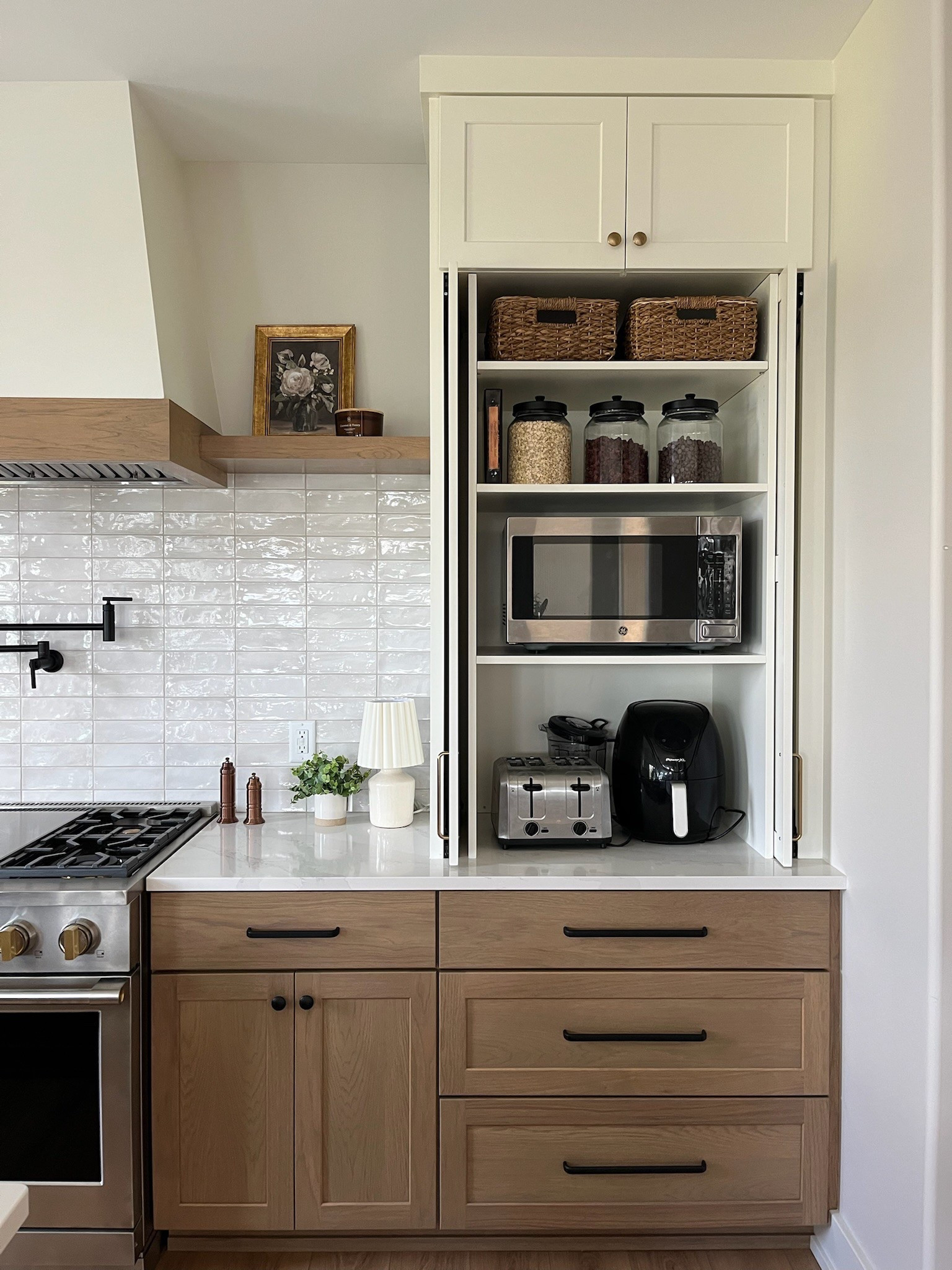 The appliance garage you didn't know you needed! As an interior designer, I often get asked the question - how do I hide my appliances but also keep them easily accessible? Appliance garages make for such an easy grab-and-go station for all your heavily used appliances. Think about your microwave, toaster, air fryer, blender, crockpot, you name it!
I don't know about you but I always feel like my counters are so cluttered when I have all my regularly used appliances sitting out all the time and this garage definitely helps make your kitchen feel more tidy and clean.
Would you want to add an appliance garage to your kitchen? If so, what appliances would you be trying to hide?

#LTKHome