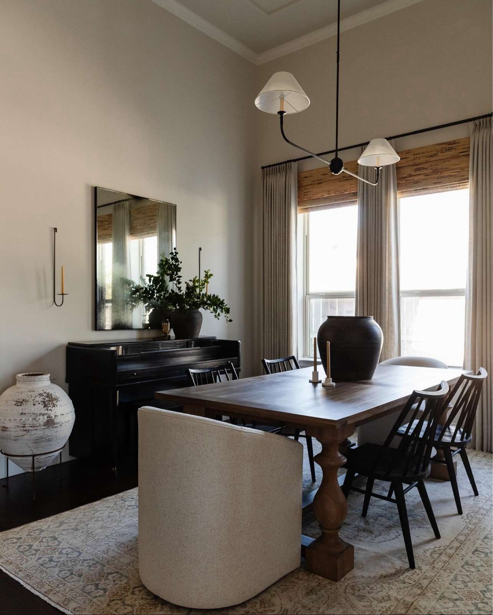 Our vintage modern dining room.  Large vintage pots, barrel back swivel dining chairs, black wood dining chairs, and linen drapes.

Use code CRAZYWONDERFUL for 15% off your drape order

Table is discontinued from RH and the large white Turkish pot was an antique find from Round Top.



#LTKHome