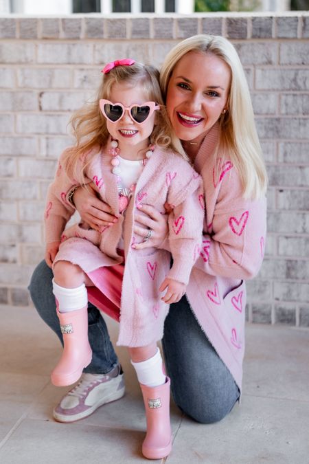 Sparkle in Pink mommy and me Valentine’s Day looks. Heart cardigan. Valentine’s Day. Vday outfits. Kids clothes. Pink rain boots. Heart sunglasses.

@sparkleinpink #sparkleinpink #ValentinesDay #momandme #boutiquefashion

#LTKkids #LTKMostLoved #LTKfamily