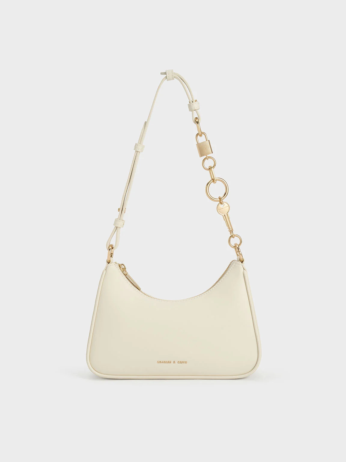 Cream Lock & Key Chain Handle Trapeze Bag | CHARLES & KEITH | Charles & Keith US