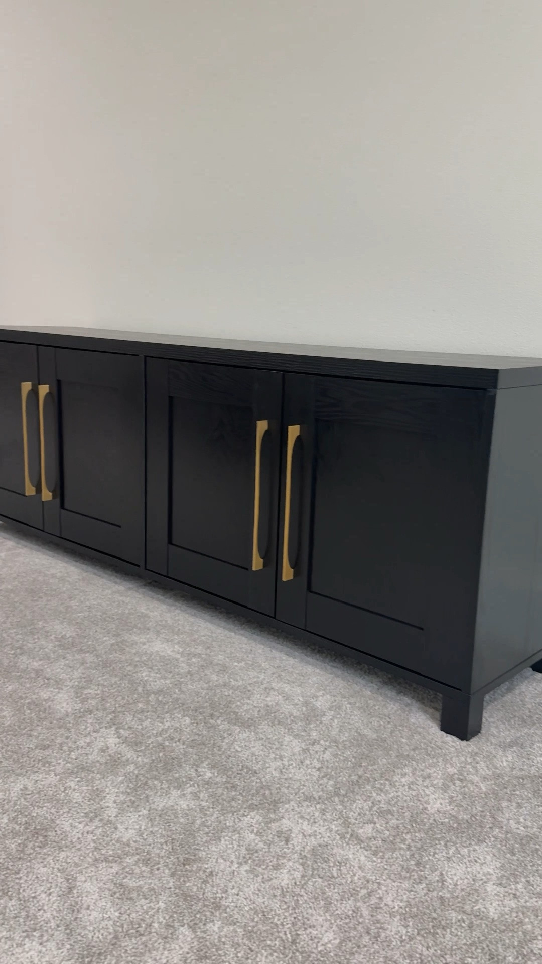 Just got this Chabot TV Stand from Wayfair for our bonus room and I am obsessed. The black wood grain texture and gold hardware give it such a high-end look — nobody would guess it’s only $325. If you’ve been looking for an affordable media stand or TV stand that actually looks expensive, linking this one plus a few other TV stand lookalikes at different price points so you can find the right fit for your living room or bonus room.

#LTKSaleAlert #LTKHome