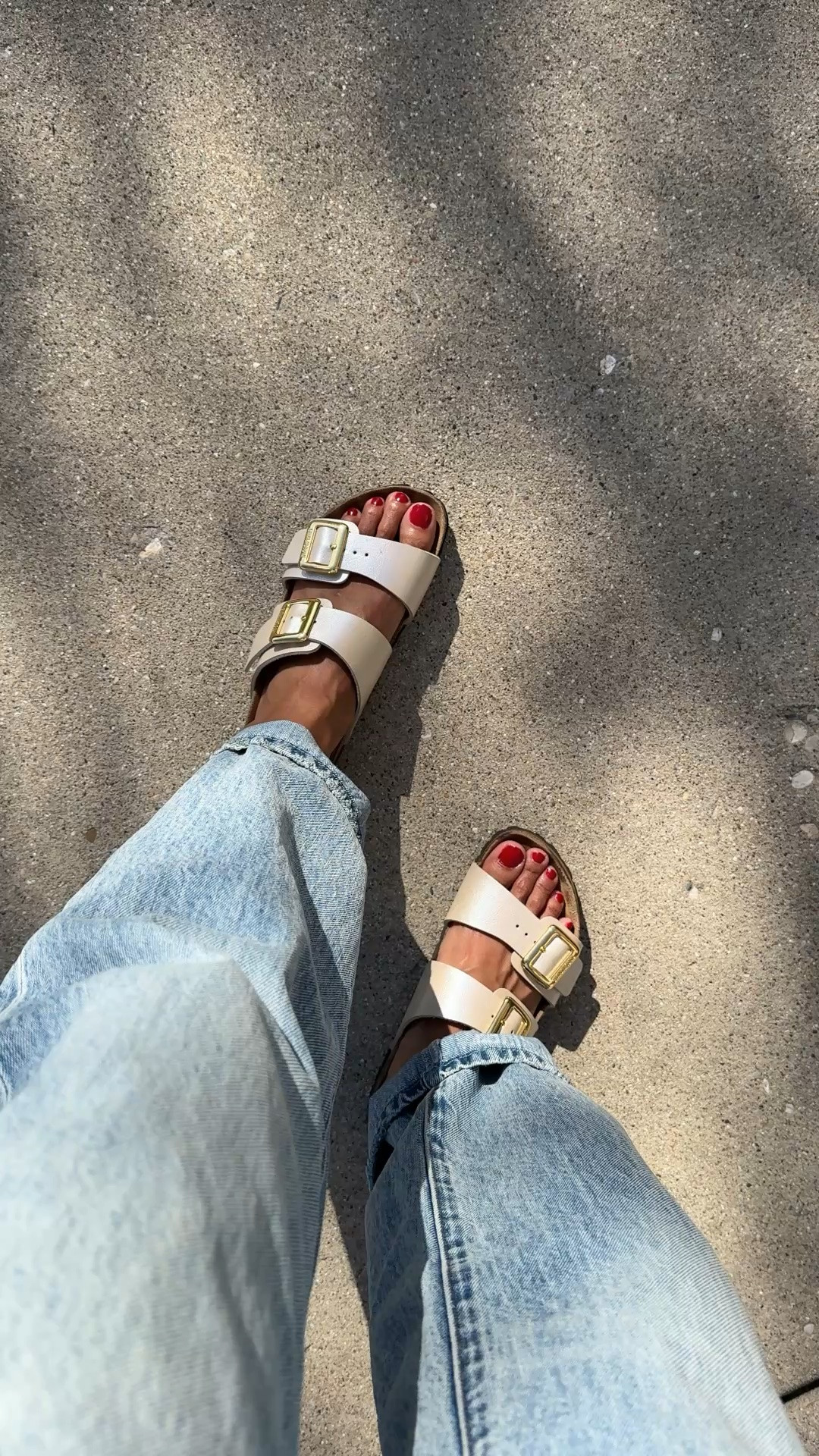 @Birkenstock US slide sandals with a pretty pearlized finish on the straps. True to size. Other colors also available. 
New red nail polish also from Birkenstock. 
Bowed jeans from @Pistola Denim true to size.

#LTKOver40 #LTKTravel