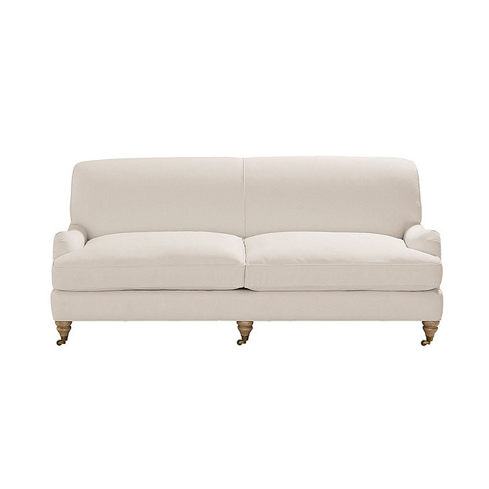 Janelle Upholstered Sofa with Rolled Arms & Antique Brass Casters | Ballard Designs, Inc.
