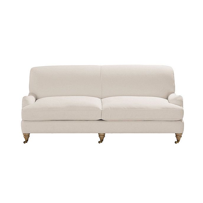 Janelle Upholstered Sofa with Rolled Arms & Antique Brass Casters | Ballard Designs, Inc.