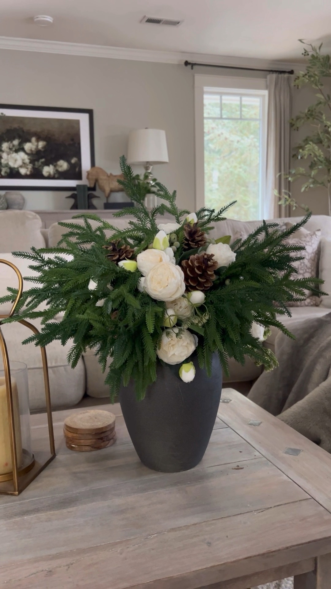A winter bouquet featuring artificial white roses, magnolias, or ranunculus paired with realistic, real-touch pine greenery exudes elegance and seasonal charm. The soft, velvety petals of the white flowers contrast beautifully with the rich, textured needles of the pine, creating a harmonious balance of delicacy and earthiness. The deep green tones of the foliage provide a grounding backdrop, while the blooms bring a sense of purity and refinement. Subtle touches of frosted pinecones or the shimmer of icy accents can add a touch of winter magic, making the arrangement feel timeless and serene. Perfect for any space, this bouquet captures the quiet beauty of the season.

#LTKWatchNow #LTKSeasonal #LTKHome