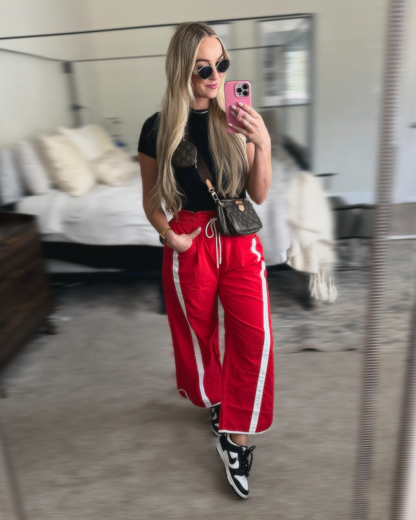 Sporty chic vibes today ✨ Styled these bold red wide leg track pants with a classic black crop tee, Nike Dunk sneakers, and my go-to Louis Vuitton crossbody bag for an effortless streetwear outfit. Obsessed with the mix of athleisure style and casual chic fashion. perfect for errands, travel days, or just a comfy OOTD.

#athleisure #streetwearstyle #falloutfits #ootdfashion #nikefashion #casualstyle