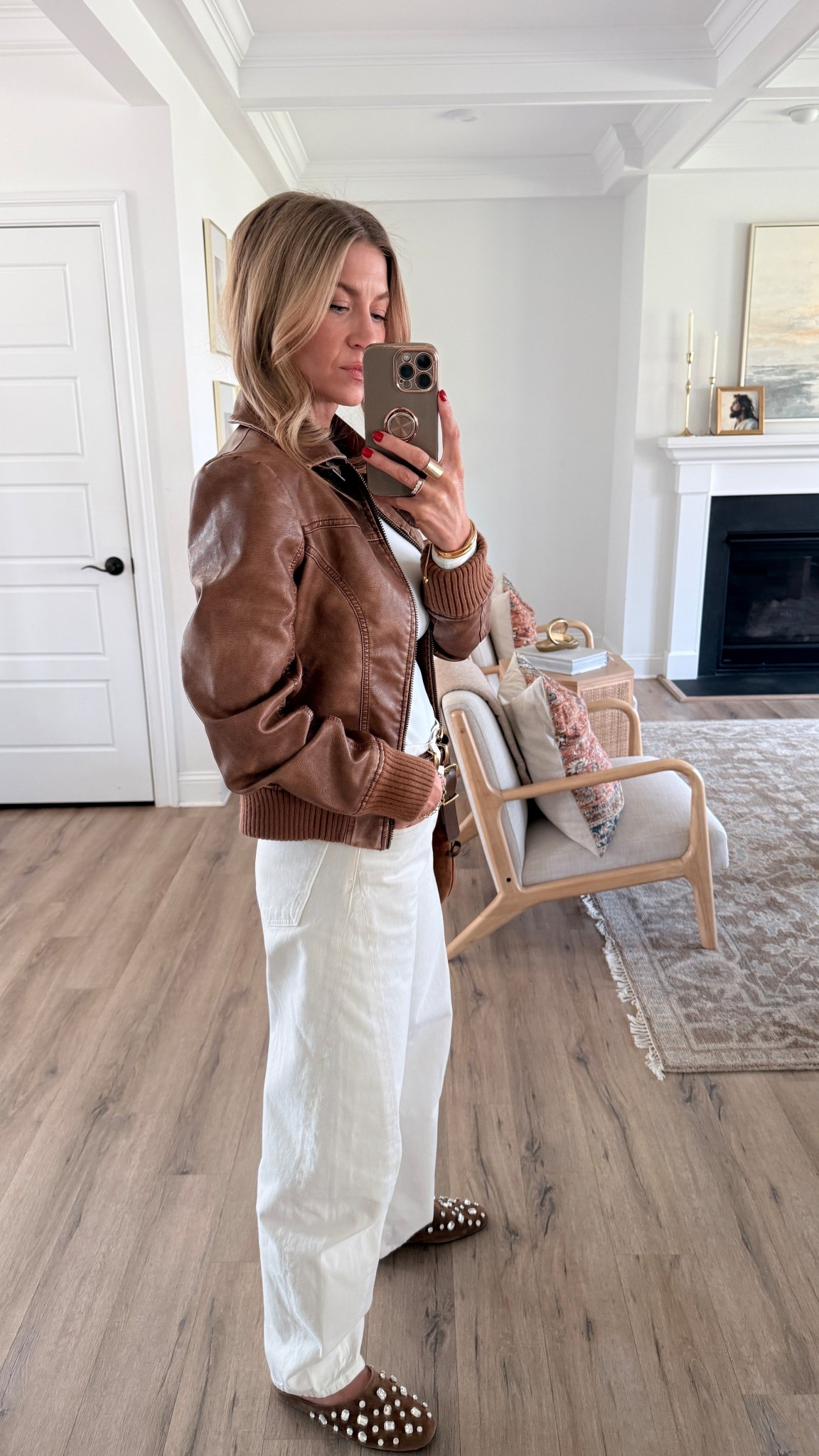 Simple spring outfit for running errands! 

White long sleeve bodysuit: runs small, wearing S
Ecru high rise barrel jeans: runs TTS, wearing a 25
Cognac faux leather bomber jacket: ON SALE, runs very small size up at least 1 size, wearing a M
Bedazzled suede mules: TTS

(Gold double hoop earrings, Cartie Baignoire watch, spring outfit, ecru denim)

#LTKootd #LTKSeasonal #LTKgrwm