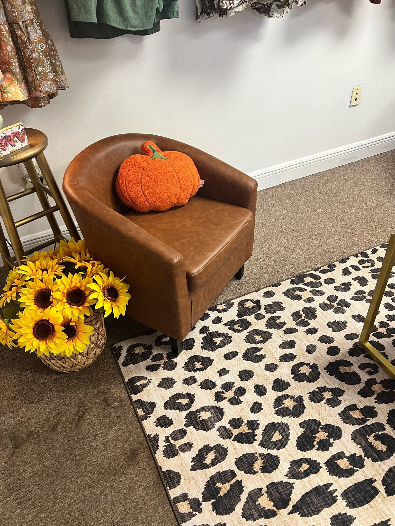 A few of my Walmart finds coming together in the boutique 🐆🤎🍂 I love how this little corner is turning out! The leopard rug + these chairs have been such good finds.