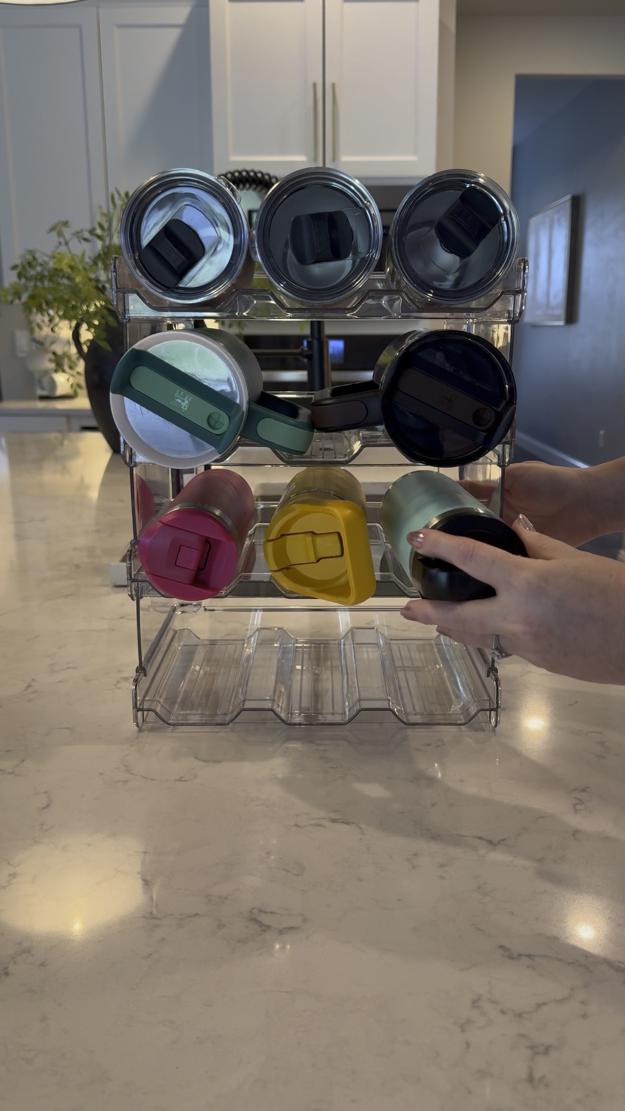 This Amazon water bottle organizer is both durable and affordable, accommodating a variety of water bottle sizes  (as shown). 

My video shows the 12 bottle organizer, but I’ve linked other sizes as well. It fits seamlessly in any standard depth cabinet! 

#LTKstyletip #LTKfindsunder50 #LTKhome