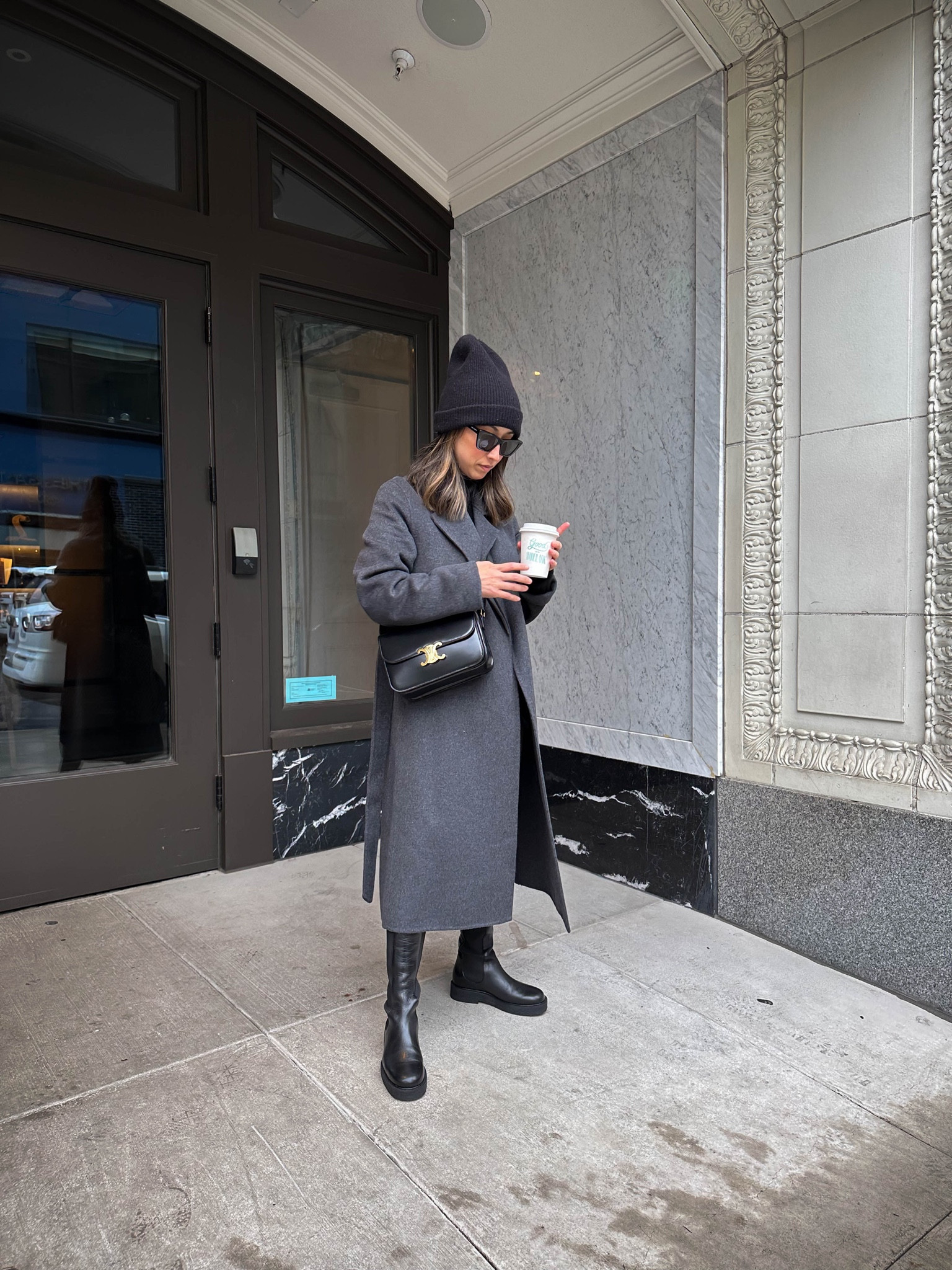 Mango belted coat. Gray coat. All black outfit. Winter outfit. Tall black boots. Boots are petite-friendly. Runs TTS, although I sized up a half size. 

Coat - Mango xxs
Sweater - Everlane xs
Jeans - Gap petite 24. Run short. Get regular. 
Boots - Staud 5.5
Beanie - j.crew 
Sunglasses - YSL Mica 
Bag - Celine Triomphe medium 

#LTKshoecrush #LTKstyletip #LTKitbag