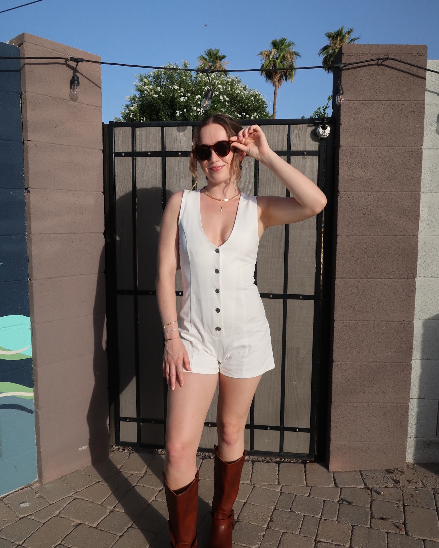 super cute button down white denim like romper v neck with brown tall western riding boots

#LTKSummerSales #LTKStyleTip #LTKU