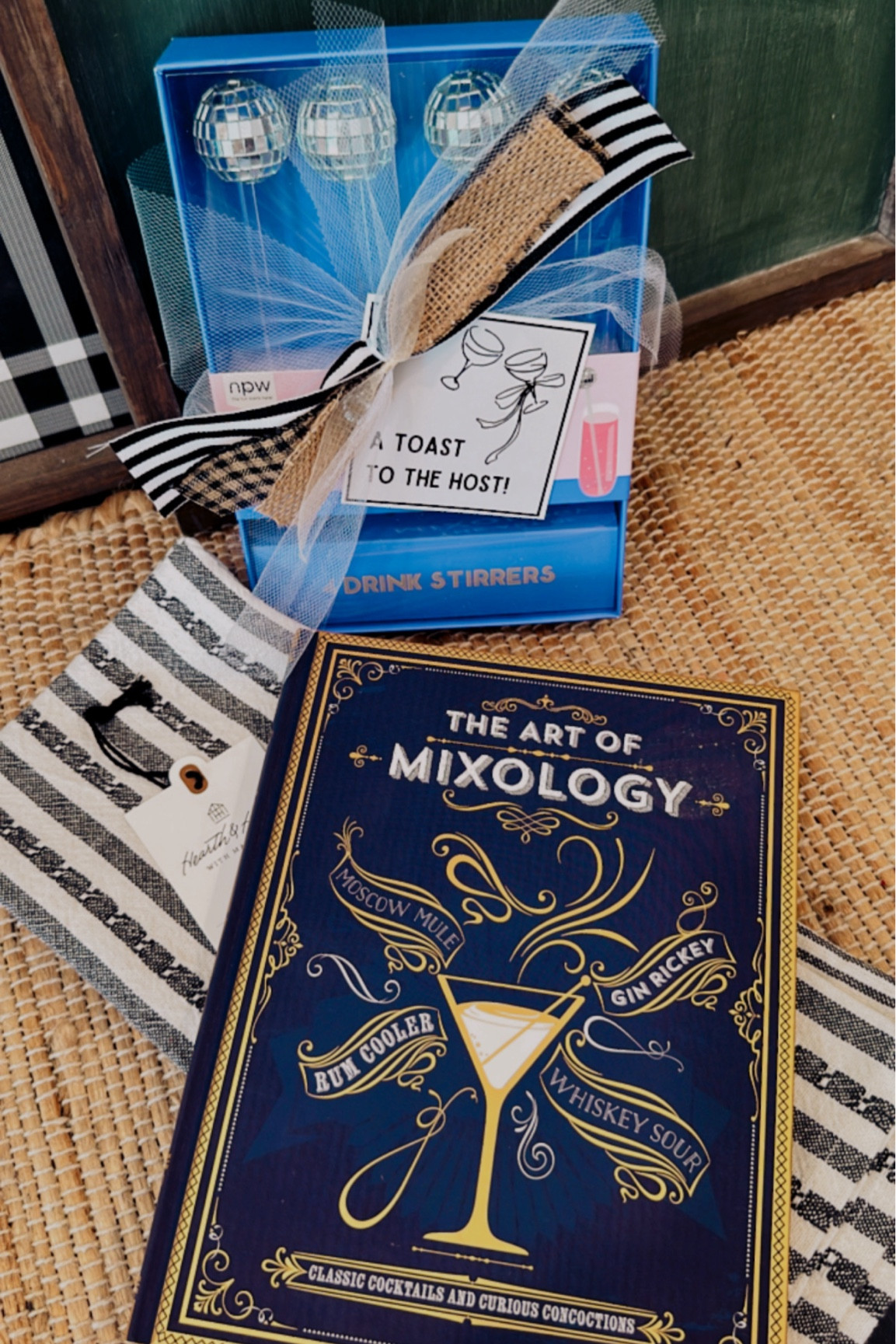 A Toast To The Host🥂 I love this cocktail recipe book! The dish towel & disco ball drink stirs are fun too. The gift tag completes this festive gift🖤

#LTKGiftGuide #LTKVideo