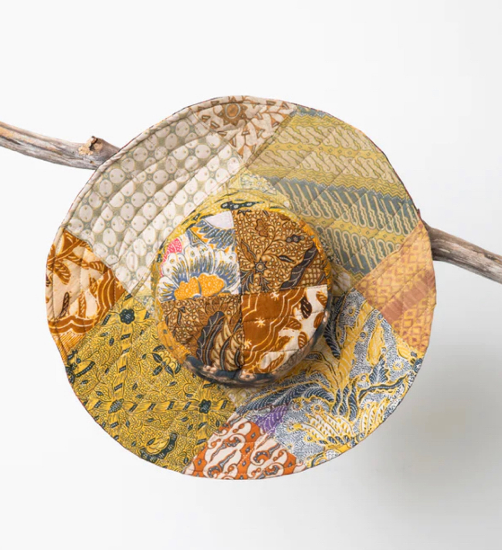 Celebrate the sunshine with this colorful patchwork sunhat. Each one is made of recycled Balinese fabric that is hand dyed using the tradtional Java printing technique. The perfect hat for gardening, dancing, relaxing, or just basking, this hat will keep you cool as a cucumber. Reverse it for a more subtle color palette, or turn it back inside out if you are looking for some beachy party hat vibes!  Which colors will the cosmos decide for you? 🤔🏝☀️👙🌊

#LTKU #LTKFind #LTKtravel