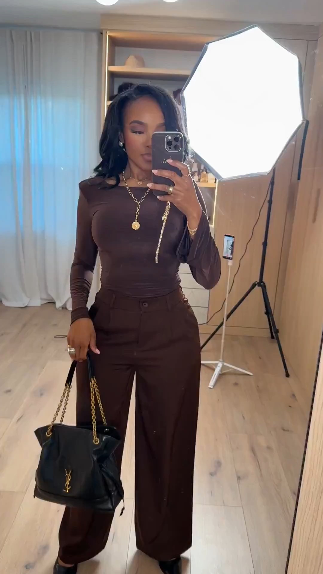 This rich brown monochrome look is such a good example of how matching tones instantly elevates an outfit. The fitted long-sleeve top paired with tailored trousers creates a clean, flattering silhouette that feels polished without trying too hard. It’s the kind of set you can dress up or down, which makes it a smart long-term shopping choice — the cost per wear keeps dropping.

Perfect for workdays, dinners, meetings, or anytime you want a chic neutral outfit that feels modern and confident.

Tap to get details and shop this full look instantly on the app.

📏 Sizing:
Wearing size Small  
Height: 5’4”  
Weight: 138 lbs  
Bust: 34D  
Waist: 27”  
Hips: 40”

This outfit works beautifully if you’re searching for brown outfit ideas, neutral monochrome outfits, elevated basics for women, polished everyday looks, and timeless capsule wardrobe pieces.

Follow me on Instagram and YouTube 