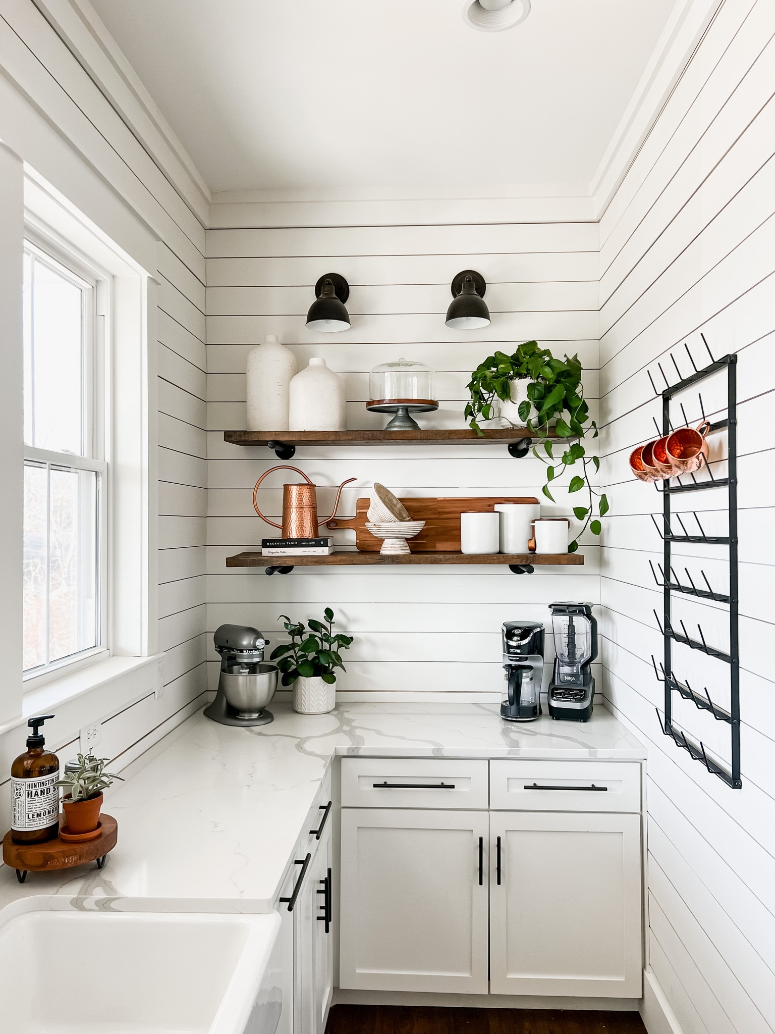 Kitchen coffe bar station open shelving shelves wall sconce light fixtures accent lighting canisters vases wall mug rack countertop appliances blender stand mixer wood charcuterie cutting board magnolia table cookbook target finds and faves deals affordable home decor and shelf styling 

#LTKstyletip #LTKhome #LTKFind