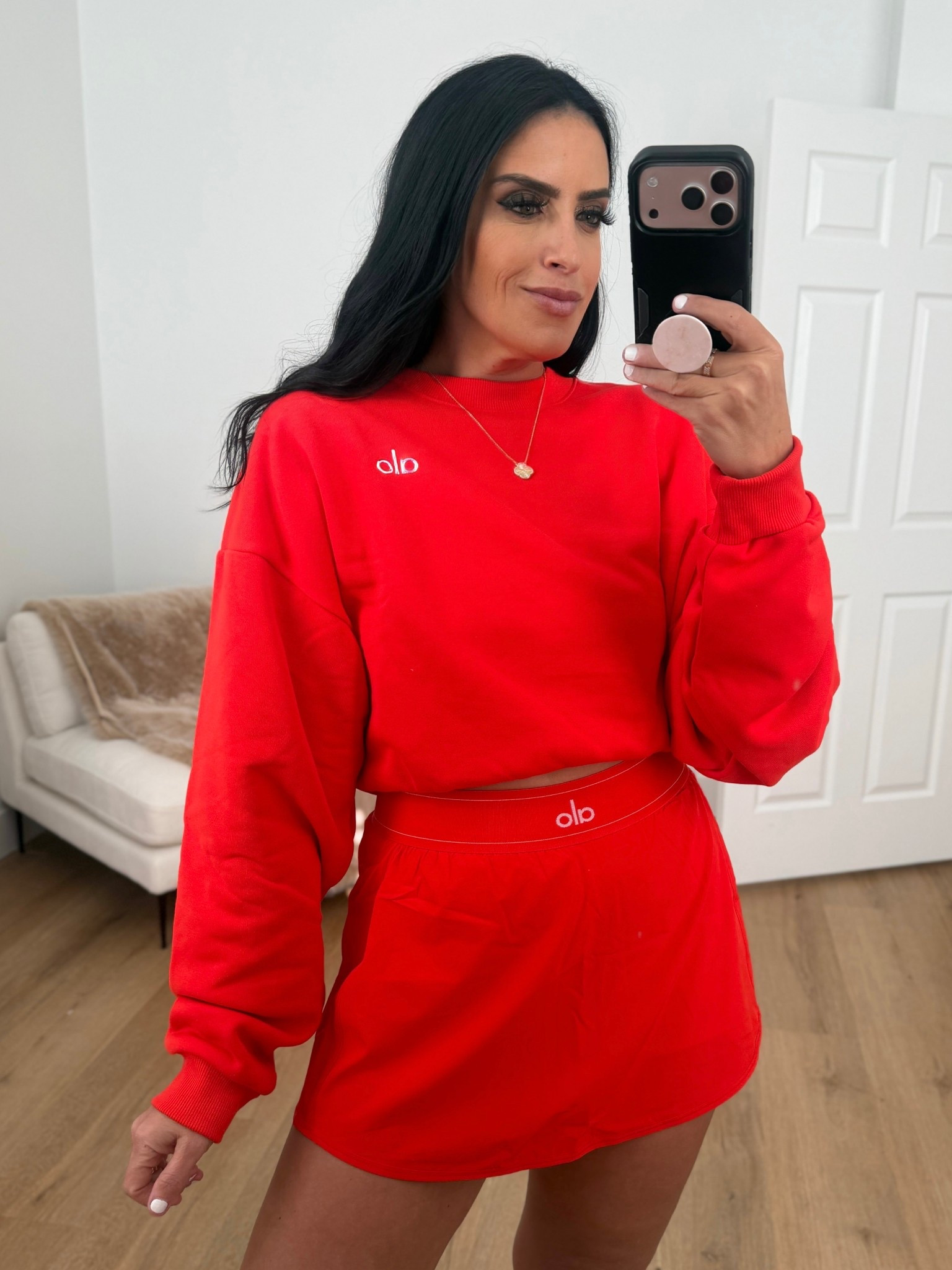 Cropped Accolade Crewneck wearing size medium. Alosoft Center Stage Bra wearing size medium. Match Point Tennis Skirt wearing size medium. 
