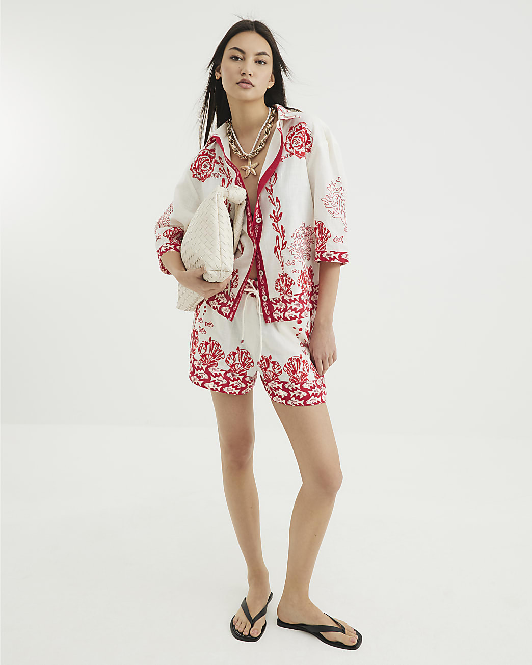 Red Shell Print Tie Waisted Shorts | River Island UK & IE