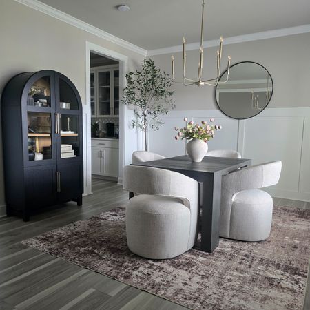 Loving my new dining room set up with these gorgeous modern swivel dining chairs and the ultrasoft washable rug from pure cozy. Dining room design, dining room furniture, dining chairs, upholstered swivel dining chair, transformer table, washable rug, neutral rug, arched cabinet, modern organic home

#LTKhome #LTKstyletip
