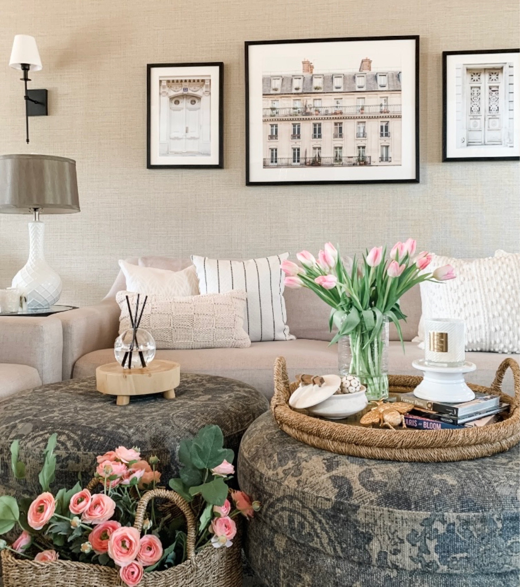 Pretty spring living room styling! Pink faux ranunculus, tulips, coastal tray, trinket dish, wood riser, black sconce set, table lamp, neutral throw pillows artwork from Etsy, Minted, coffee table book. Sales at Ballard Designs. Anthropologie, Target, Walmart home, Afloral. Kirkland’s. Free shipping. 


#LTKsalealert #LTKhome #LTKunder50