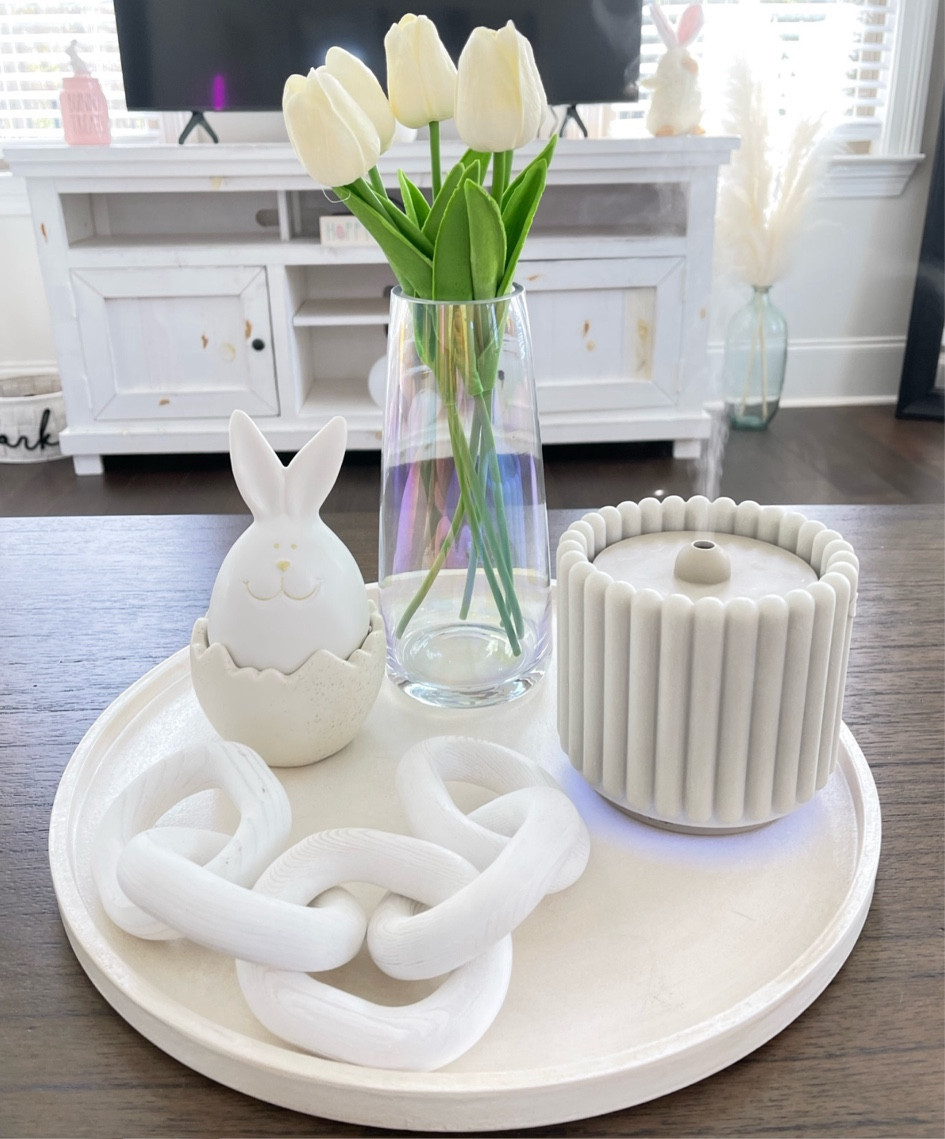 Easter coffee table decor 🐰🌷

Coffee table decor, Easter decorating aesthetic, minimalist spring decor, tulips, flower vase, Easter basket, Easter dress, aesthetic diffuser, home decor, spring decor, spring trends, Easter 2025, spring home decor minimalist aesthetic, spring tulips, white flower arrangement decor
#LTKFind 

#LTKSpringSale 

#LTKSeasonal #LTKhome #LTKstyletip