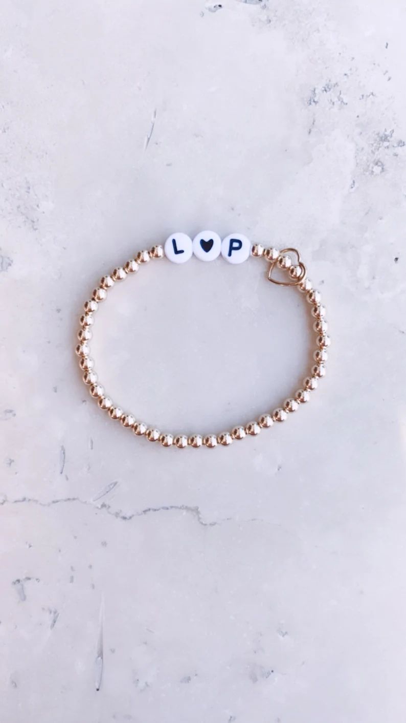 Gold + White Heart Custom Initial Bracelet // 14k gold filled beaded stretch bracelet | Etsy (US)