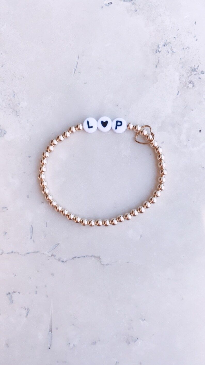 Gold + White Heart Custom Initial Bracelet // 14k gold filled beaded stretch bracelet | Etsy (US)