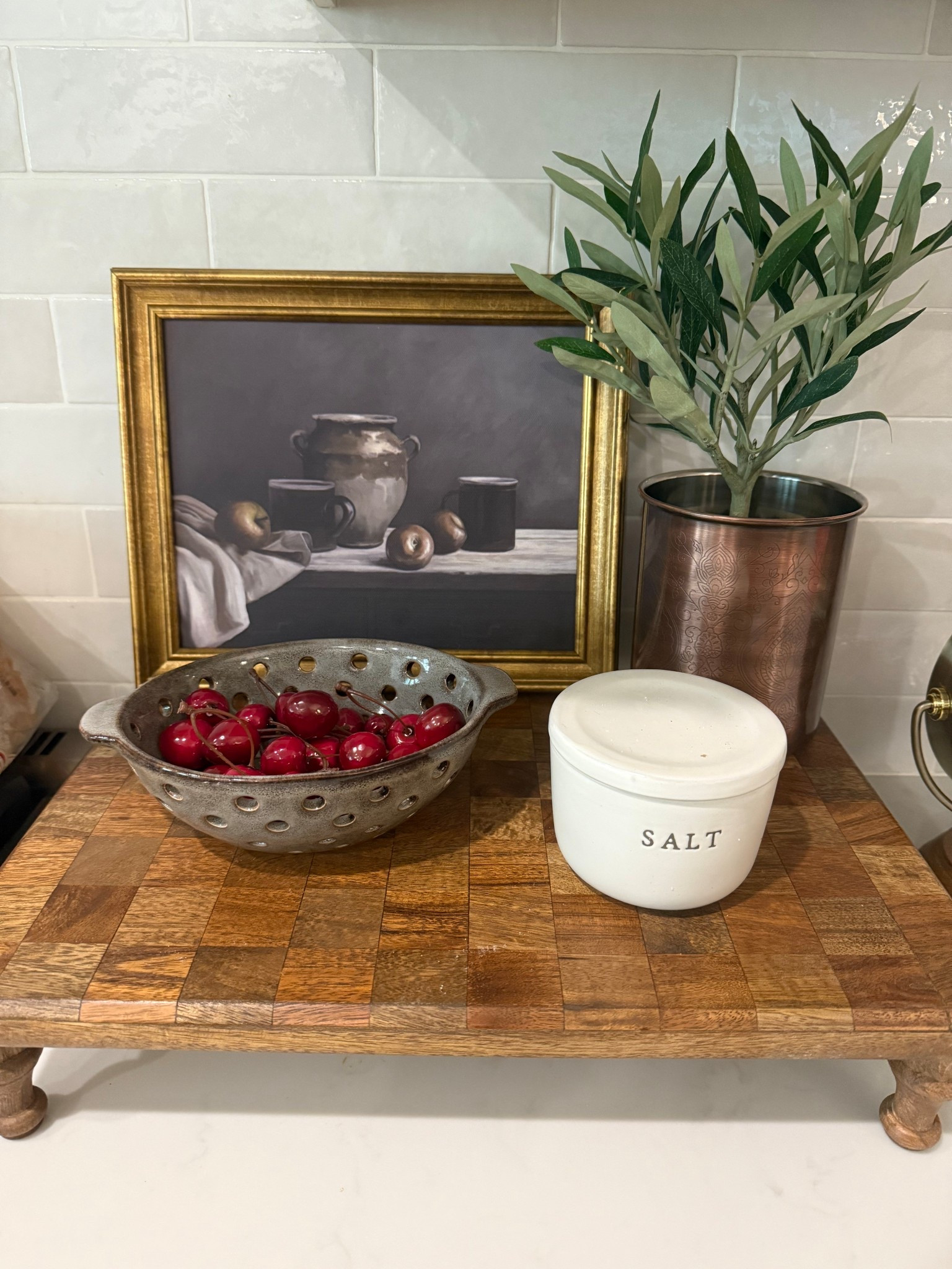 Kitchen styling 
Counter decor 
Copper canister
Berry basket bowl
Checkered wood raised stand 

#LTKSeasonal #LTKHome #LTKFindsUnder50