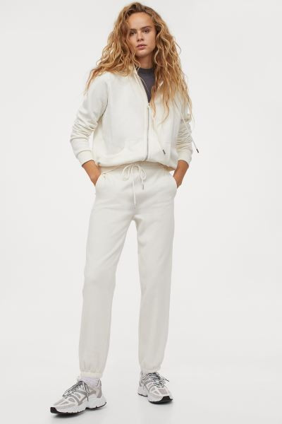 Sweatpants in soft sweatshirt fabric made from a cotton blend. High waist with covered elasticati... | H&M (UK, MY, IN, SG, PH, TW, HK)