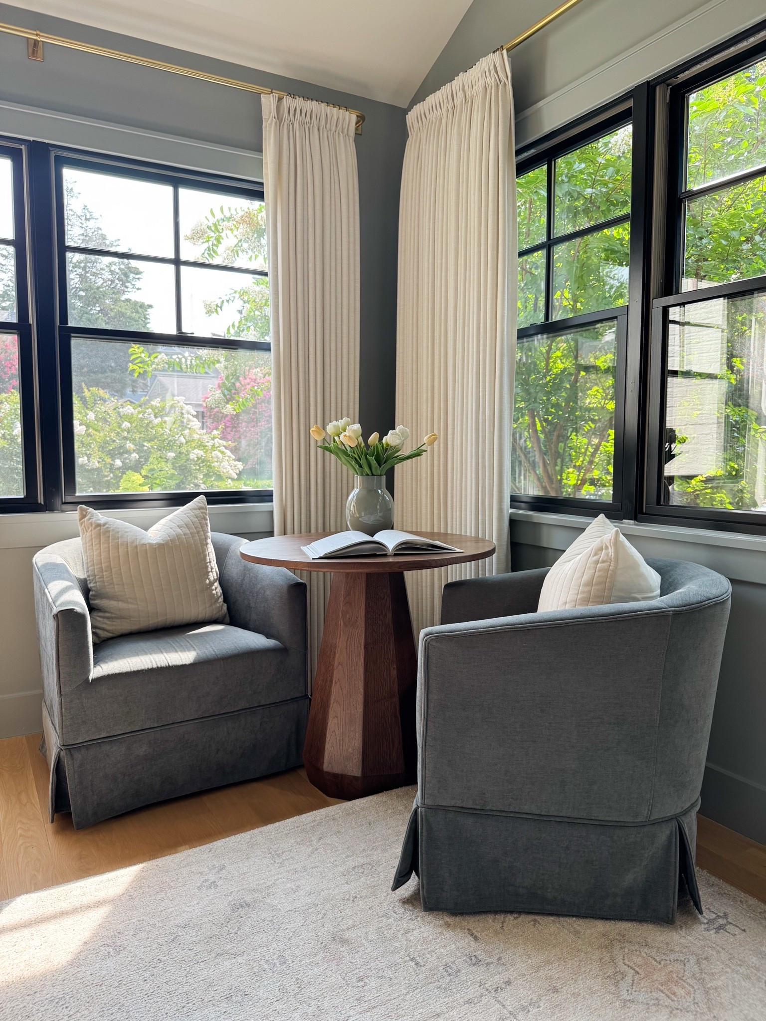 One of my favorite corners in our home—and proof that a small space can be both beautiful and functional. This cozy reading nook doubles as an extra home office workspace and the spot where my kids inevitably end up coloring while I work. The blue-gray swivel chairs are the perfect moody neutral (technically called gray, but much richer in person) and pair beautifully with Benjamin Moore Boothbay Gray walls for a timeless, collected look.
Linking the swivel chairs, rug, lighting, and all the details from this cozy, multipurpose home office nook below.

#LTKdayinmylife #LTKHome #LTKSaleAlert